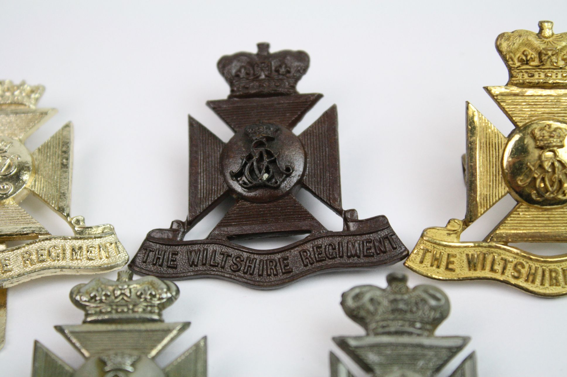 A Collection Of Seven The Wiltshire Regiment Cap Badges To Include A Bronzed, Brass, White Metal, - Image 5 of 14