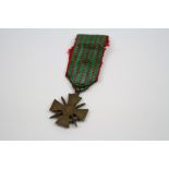 A French World War One Croix De Guerre Miniature Medal Complete With Original Ribbon.