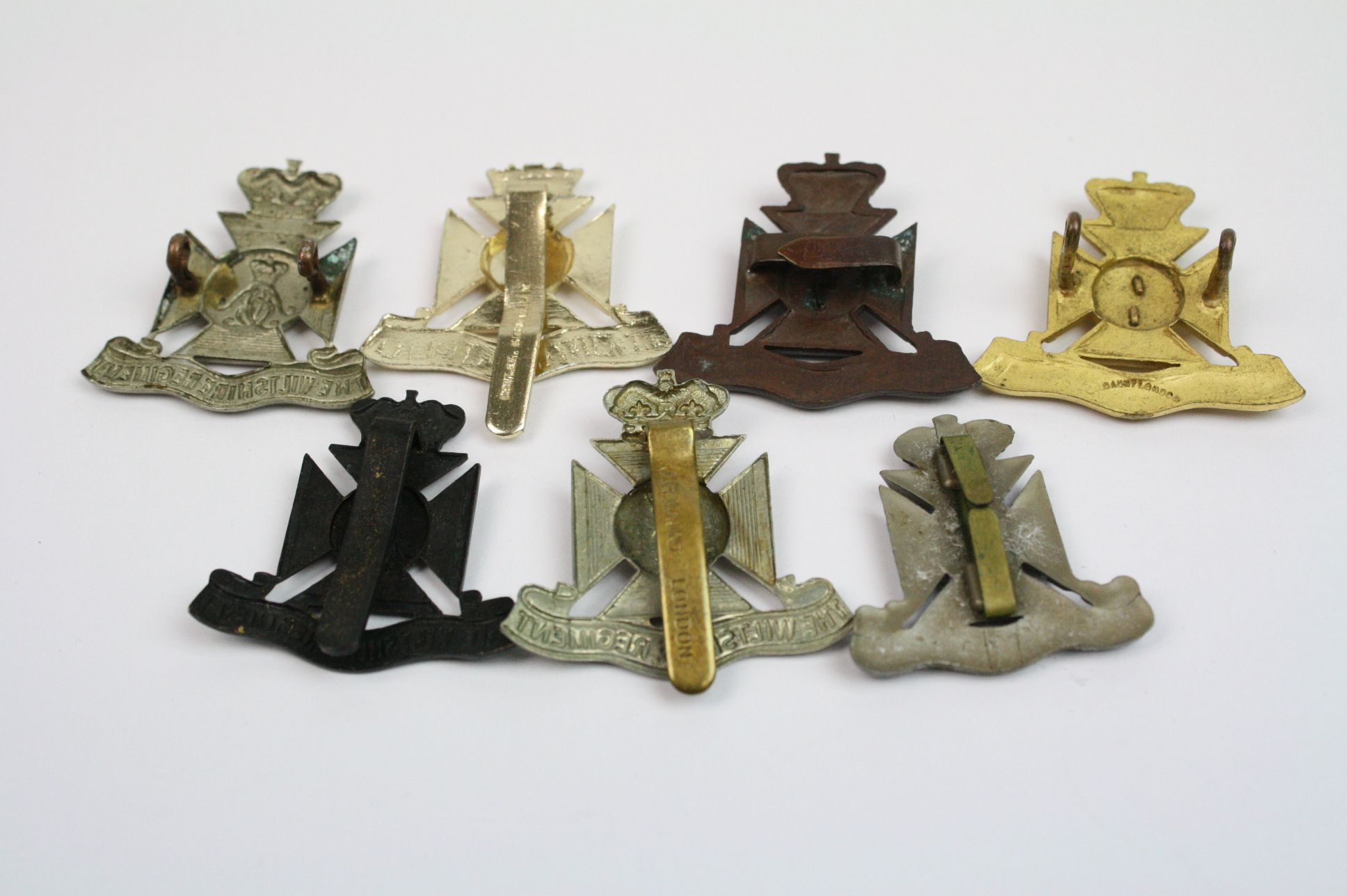 A Collection Of Seven The Wiltshire Regiment Cap Badges To Include A Bronzed, Brass, White Metal, - Image 10 of 14