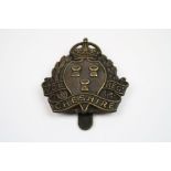 A Bronze Cap Badge To The Cheshire Volunteer Regiment With Kings Crown And Slider To The Rear.