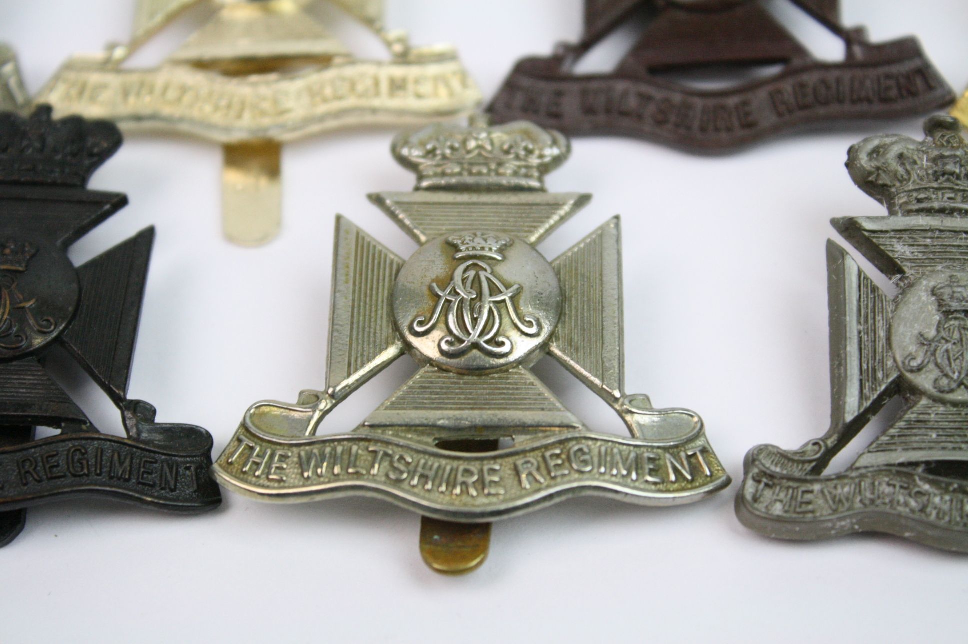 A Collection Of Seven The Wiltshire Regiment Cap Badges To Include A Bronzed, Brass, White Metal, - Image 8 of 14