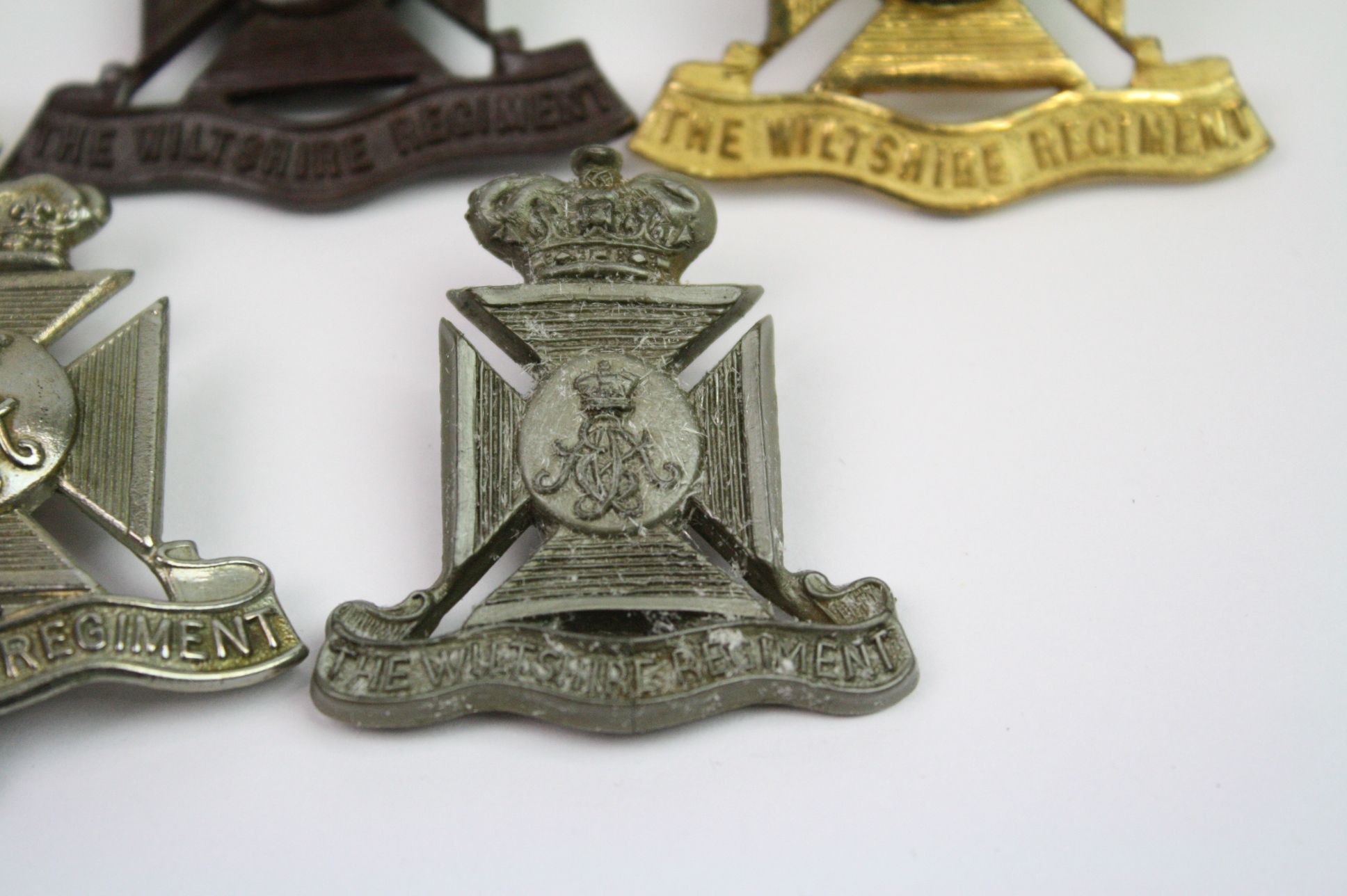 A Collection Of Seven The Wiltshire Regiment Cap Badges To Include A Bronzed, Brass, White Metal, - Image 7 of 14