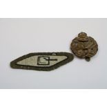 Two Vintage Kings Crown Tank Corps Badges To Include A Metal Cap Badge And A Cloth Arm Badge.