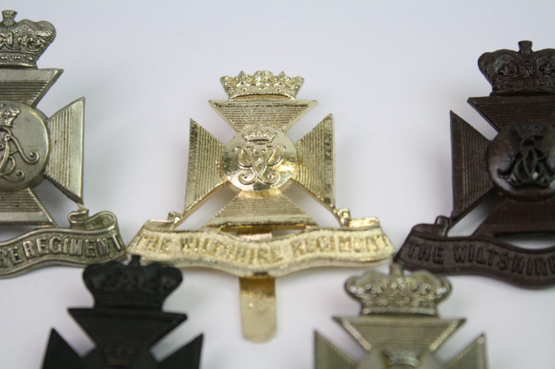 A Collection Of Seven The Wiltshire Regiment Cap Badges To Include A Bronzed, Brass, White Metal, - Image 4 of 14