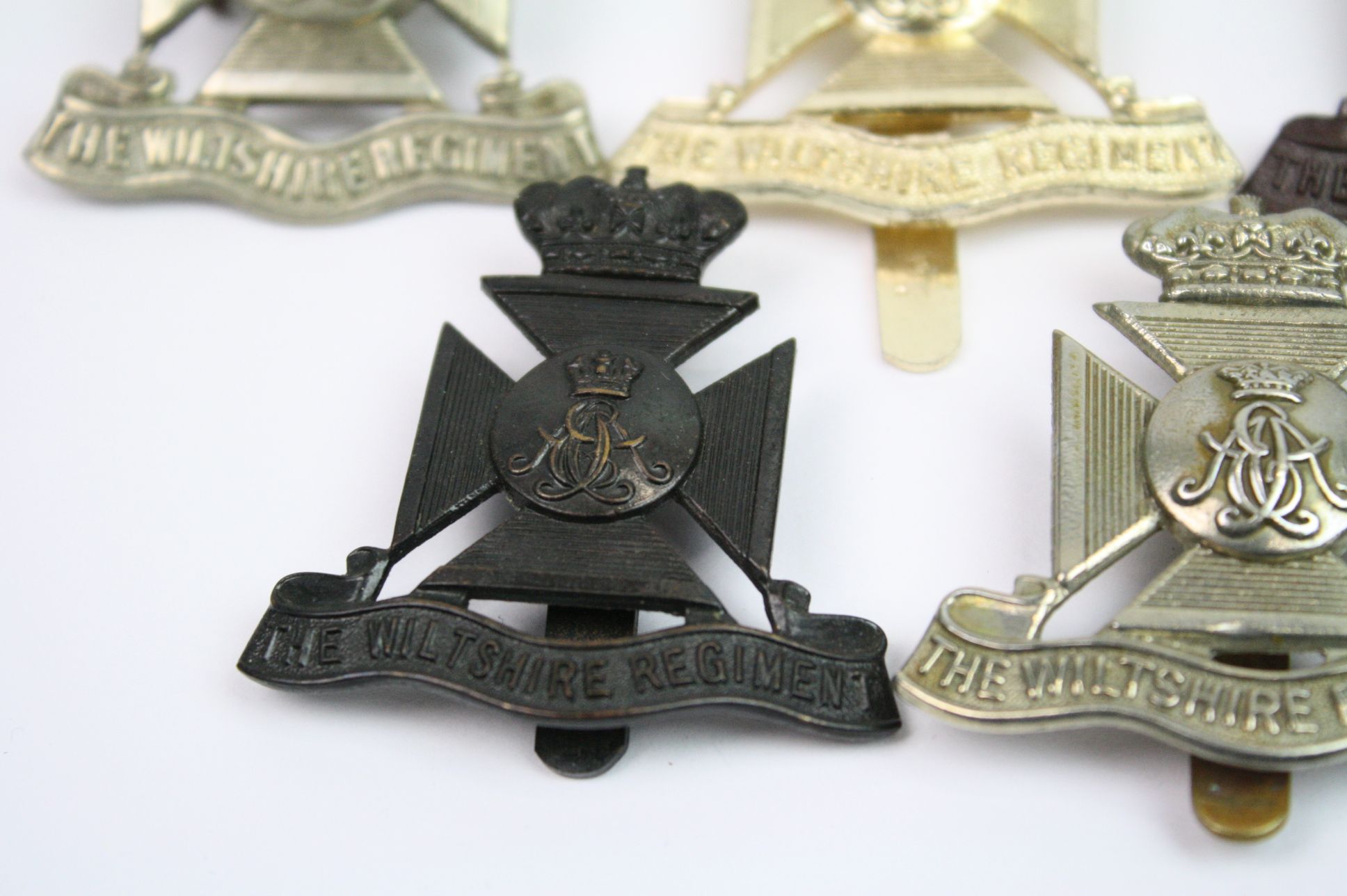 A Collection Of Seven The Wiltshire Regiment Cap Badges To Include A Bronzed, Brass, White Metal, - Image 9 of 14