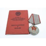 A Full Size Russian / Soviet Type 1 Medal For Distinguished Labour Complete With Original Document