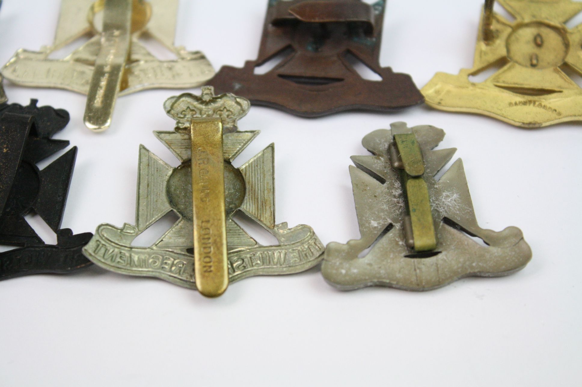 A Collection Of Seven The Wiltshire Regiment Cap Badges To Include A Bronzed, Brass, White Metal, - Image 13 of 14