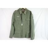 A Reproduction German World War Two Heer Soldiers Uniform To Include Tunic And Trousers.