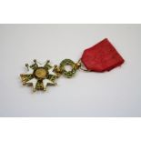 A French Legion D'Honneur Miniature Medal With Original Ribbon.