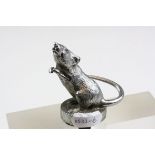 A vintage cast white metal car mascot of a Rat, stands approx 65mm excluding fixing.