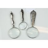 A set of 3 silver plated miniature magnifing glasses