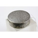 A hallmarked French silver patch box with mirrored lid, approx 5cm diameter.