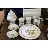 A group of German Porcelain to include a pair of rose decorated meissen vases raised on four