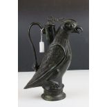 A bronzed spelter lidded claret type jug in the form of a parrot