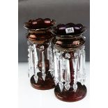 A pair of antique ruby glass lustres with matched droplets.