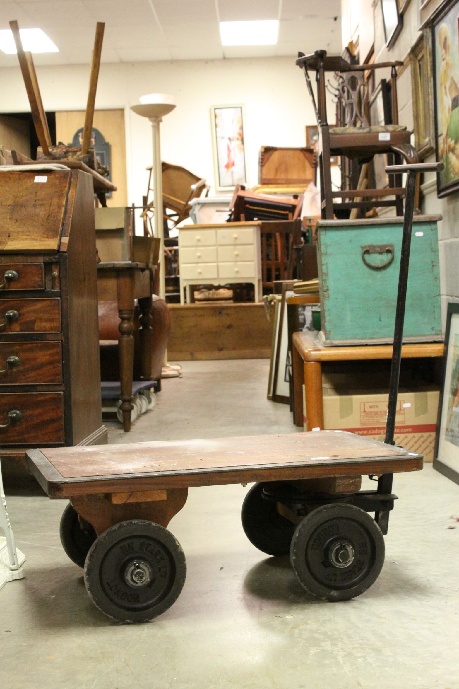 Early 20th century Gold Bullion Trolley with a Hardwood Top and Cast Iron Base, each wheel stamped '