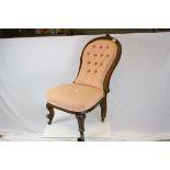Victorian Walnut Framed Spoon Button Back Chair, the top rail with shell carving and raised on