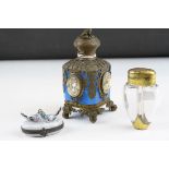 An antique blue glass scent bottle with ornate brass decoration and miniature dog figure to hinged