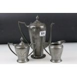 A pewter three piece tea set marked Paul Revere.