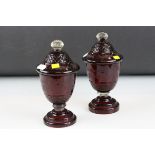 A pair of Bohemiam ruby glass lidded bon bon urns.