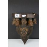 Folk Art Wooden Wall Bracket / Shelf carved with Eight Face Masks of Men, all different designs, h.