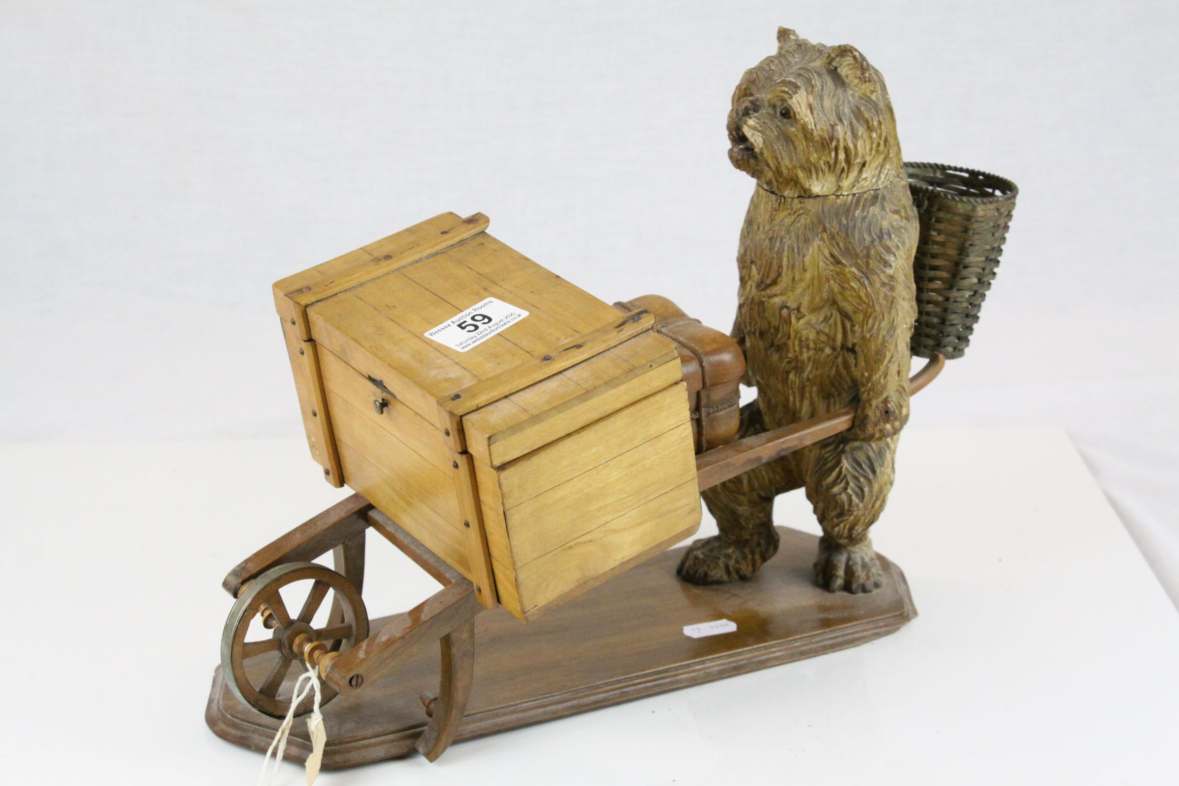 Black Forest Carved Wooden Tobacco or Match Holder in the form of a Dog with a Basket on his back