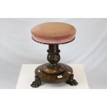 Mid Victorian Mahogany Adjustable Piano Stool raised on a stem carved with acanthus leaves and