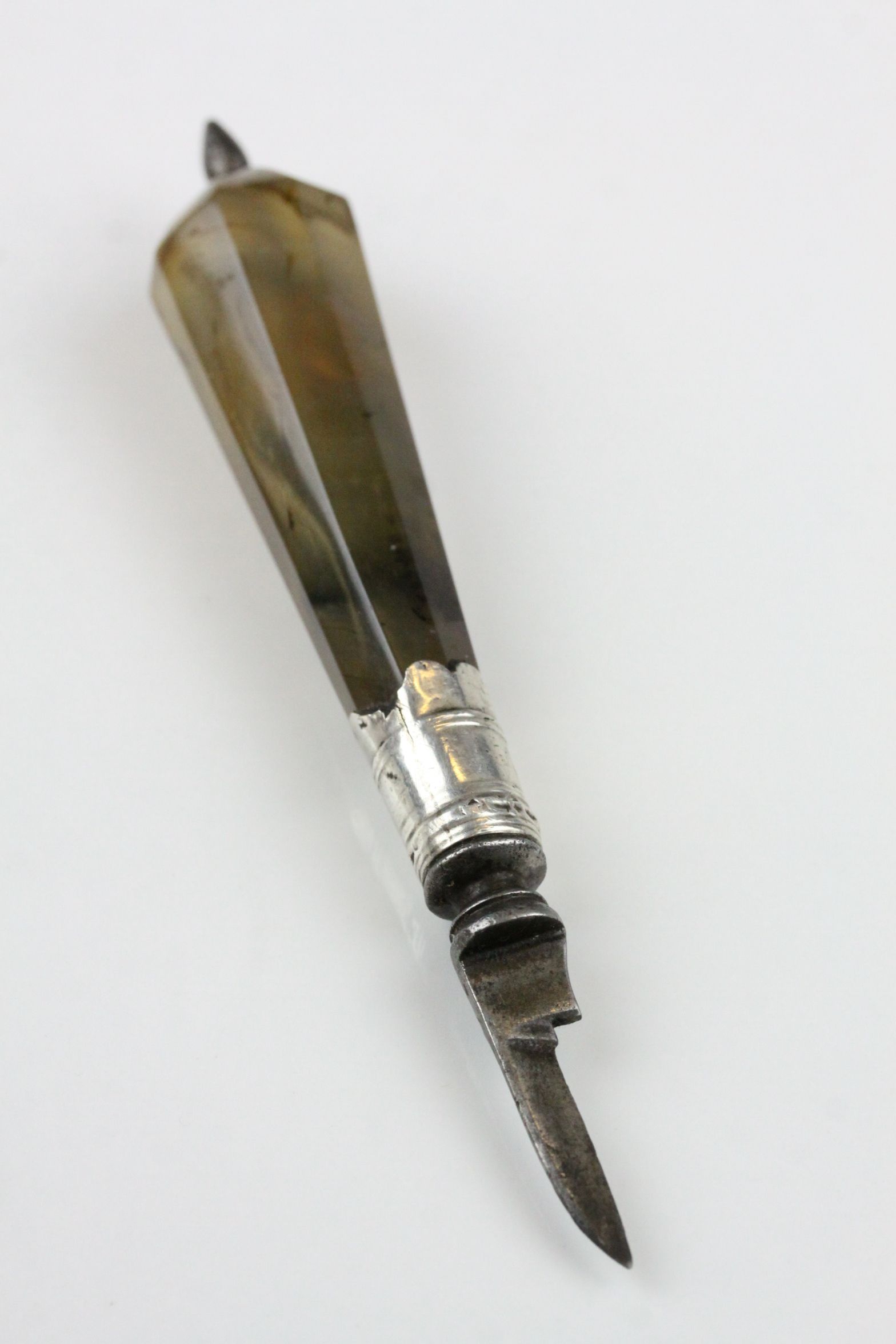 A 19th century quill knife with agate handle and white metal embellishments.