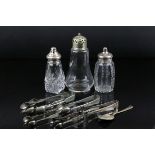 A small collection of silver plated items to include sugar tongs and sugar shakers.