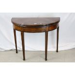 Regency Mahogany Inlaid Demi-Lune Fold-Over Tea Table raised on square tapering legs with spade