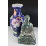 A contemporary lustre figure of a seated buddha and an oriental blue ground vase decorated with
