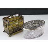 A cut glass Royal Brierly oval trinket box with plated lid with rococo decoration and a