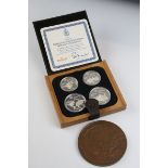 A cased Canadian 1976 Olympic coin proof set together with a Bombay Burmah trading corporation