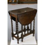 Small Oak Oval Gate-leg Table raised on Barley-twist legs, h.73cms L.58cms