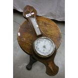 A mid 20th century oak cased banjo style wall barometer.