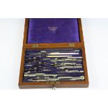 A vintage draftsman's drawing tool set in original fitted wooden case.
