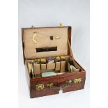 Mid 20th century Crocodile Skin Travelling Case, the interior fitted with Four Glass Jars with