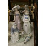 Three Nao figurines to include girl with broken jug plus two others and a figure of lady with