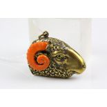 A brass vesta in the form of a Ram's head with faux coral ears