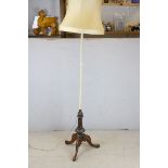 Wooden Standard Lamp raised on carved supports and three splay legs