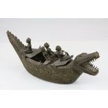 Benin Style Bronze in the form of a Crocodile Shaped Boat with Four Figures, L.42cms