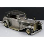 A mid century novelty decanter and four glass holder in the form of a musical Roll Royce..