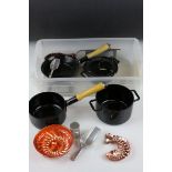 A childs kitchen set to include pots and pans and jelly moulds.