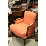 French Style Armchair with carved scroll back rail, arms and legs, upholstered in coral fabric