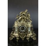 French Style Ornate Brass Cased Mantel Clock surmounted by a Horse and Figure, with key, h.42cms