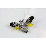 A silver and enamel bee brooch set with marcasites