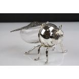 A silver plated honey pot in the form of a bee