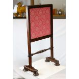 William IV Mahogany Framed Firescreen with fabric covered panel, raised on trestle supports each