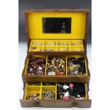 A wooden jewellery box complete with contents to include silver and costume jewellery.