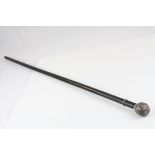 An antique ebonised walking cane with wire work knop.